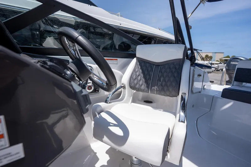 Slide: The Image of 2024 Monterey M-45 boat interior with steering wheel and luxurious seating. - 22