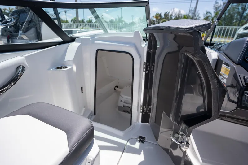 Slide: The Image of 2024 Monterey M-45 boat interior with open cabin door, showcasing sleek design and seating. - 24
