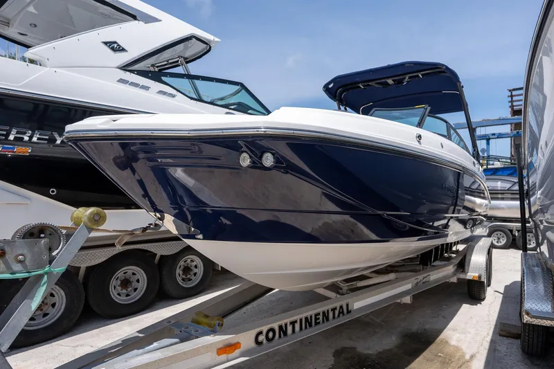 Slide: The Image of 2024 Monterey M-45 boat on trailer, sleek design, blue and white exterior. - 4