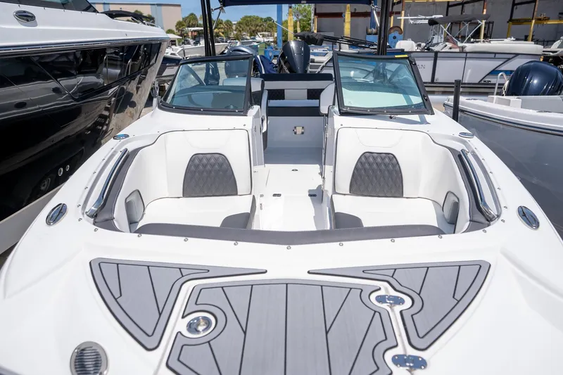 Slide: The Image of 2024 Monterey M-45 boat with sleek design and comfortable seating in a marina setting. - 7