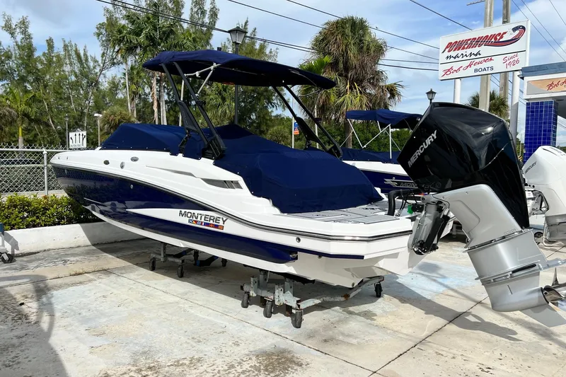 Slide: The Image of 2024 Monterey M-45 boat with Mercury outboard engine, parked outdoors. - 9