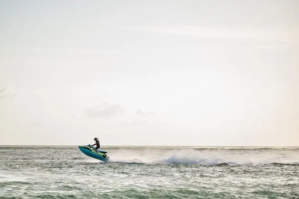 Slide: The Image of 2025 Yamaha WaveRunner JetBlaster PRO 2-Up speeding across ocean waves. - 11