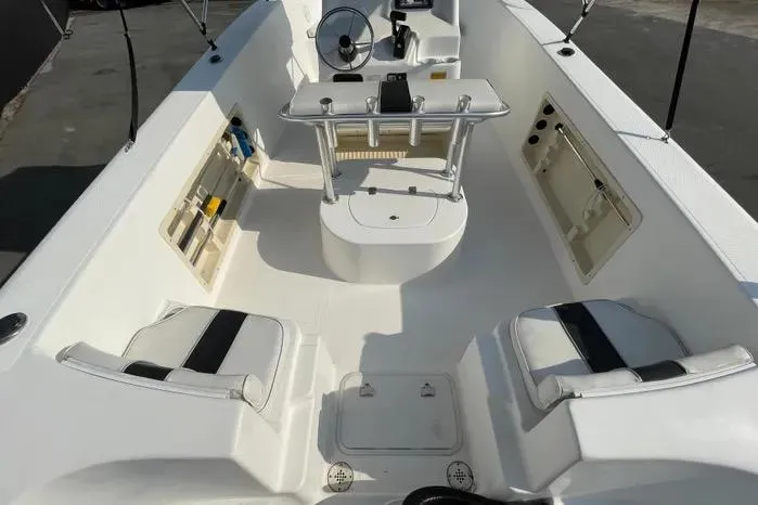 Slide: The Image of 2004 Kenner Fishmaster Travis Edition 220 boat with canopy and spacious deck. - 13