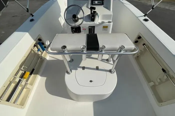 Slide: The Image of Open storage compartment on 2004 Kenner Fishmaster Travis Edition 220 boat. - 16