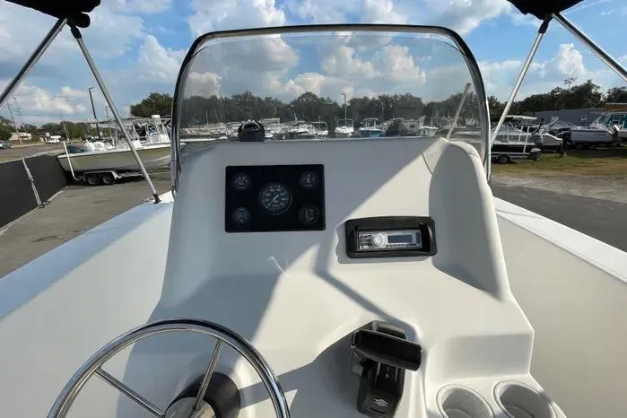 Slide: The Image of Dashboard gauges of a 2004 Kenner Fishmaster Travis Edition 220 boat. - 25