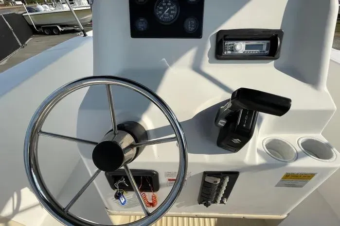 Slide: The Image of Dashboard of 2004 Kenner Fishmaster Travis Edition 220 with gauges and stereo system. - 26