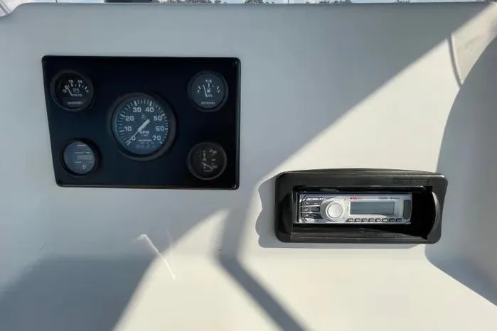 Slide: The Image of 2004 Kenner Fishmaster Travis Edition 220 ignition with keys and safety lanyard. - 28