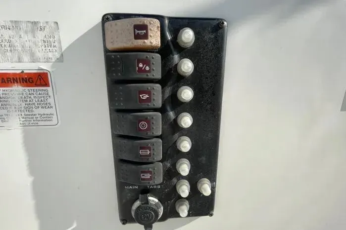 Slide: The Image of 2004 Kenner Fishmaster Travis Edition 220 boat interior with storage and seating. - 29