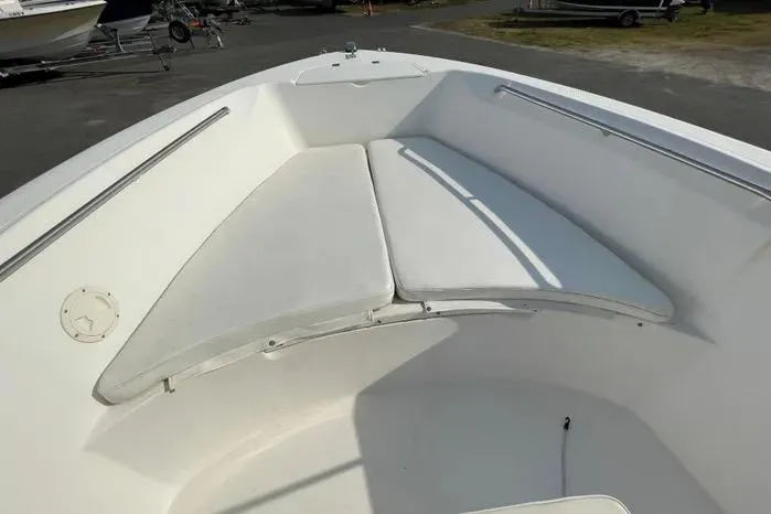 Slide: The Image of 2004 Kenner Fishmaster Travis Edition 220 boat deck with storage compartment. - 37