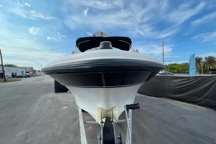 Slide: The Image of Outboard motor with "250" label on a 2004 Kenner Fishmaster Travis Edition 220 boat. - 4