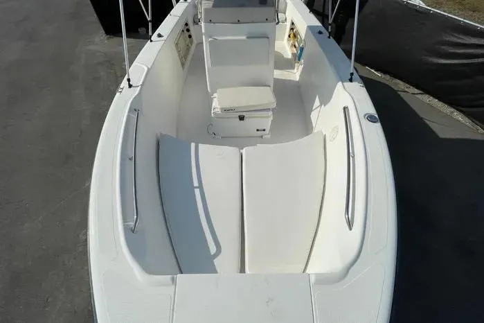 Slide: The Image of 2004 Kenner Fishmaster Travis Edition 220 boat interior with seating and storage. - 43
