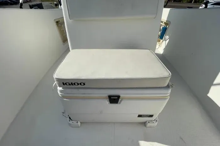 Slide: The Image of 2004 Kenner Fishmaster Travis Edition 220 boat interior with steering console and seating. - 47