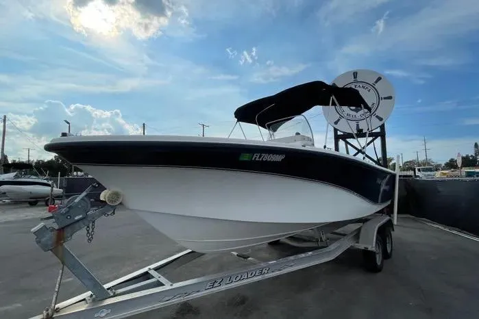 Slide: The Image of 2004 Kenner Fishmaster Travis Edition 220 boat propeller and trailer close-up. - 5