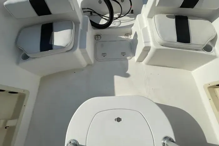 Slide: The Image of 2004 Kenner Fishmaster Travis Edition 220 boat compartment with battery and wiring. - 57