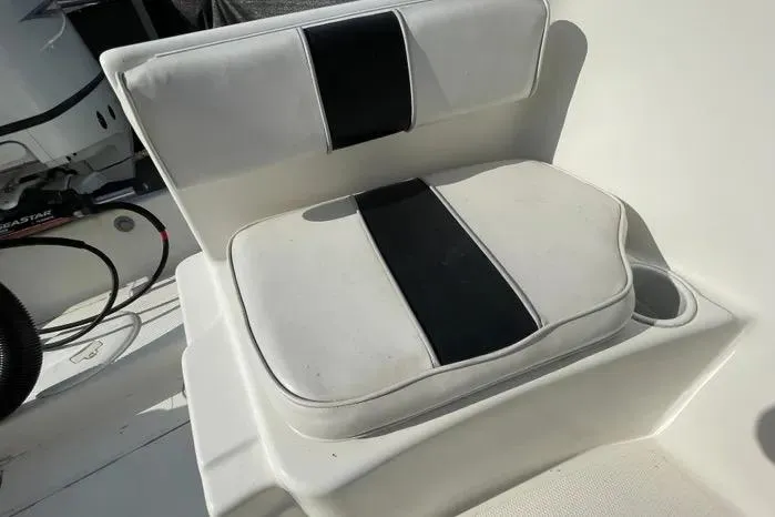 Slide: The Image of 2004 Kenner Fishmaster Travis Edition 220 boat interior with Suzuki motor. - 61