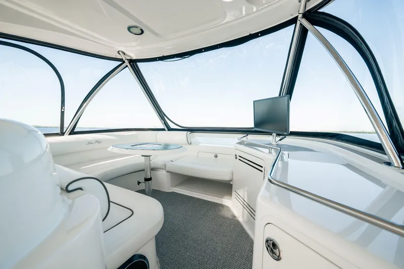 Slide: The Image of Luxurious interior of 2007 Sea Ray 580 Sedan Bridge yacht with panoramic windows and modern amenities. - 13