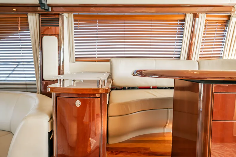 Slide: The Image of Luxurious interior of 2007 Sea Ray 580 Sedan Bridge yacht with elegant wood finishes. - 23