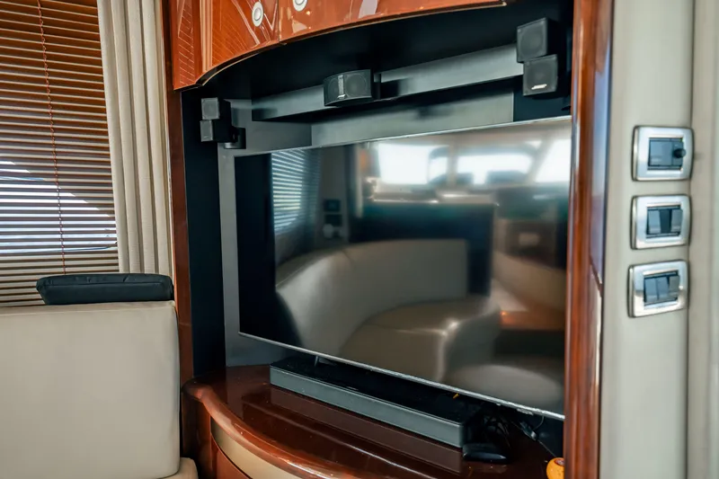 Slide: The Image of Luxurious interior of 2007 Sea Ray 580 Sedan Bridge yacht with modern entertainment system. - 24