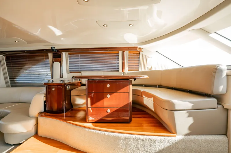 Slide: The Image of Luxurious interior of 2007 Sea Ray 580 Sedan Bridge yacht with elegant seating and wooden accents. - 25