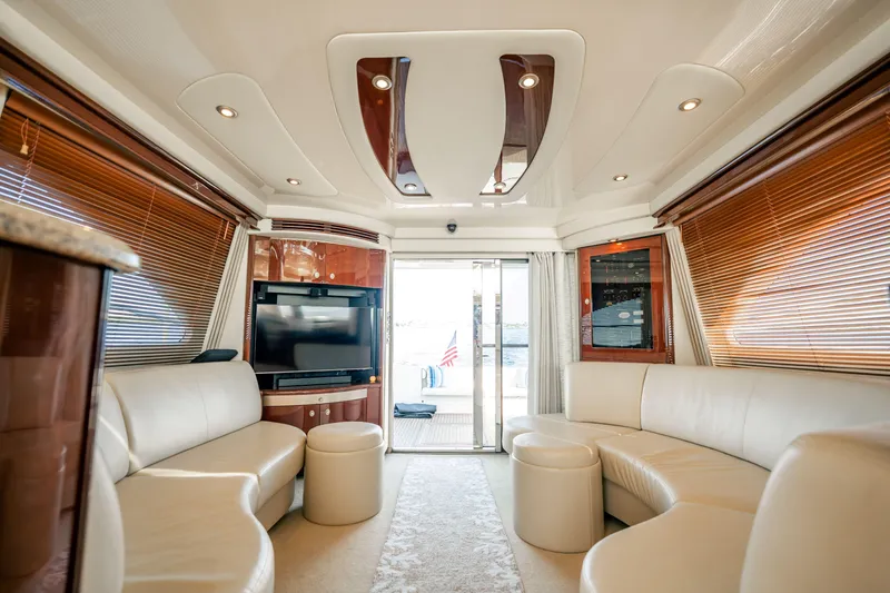 Slide: The Image of Luxurious interior of 2007 Sea Ray 580 Sedan Bridge yacht with leather seating and TV. - 27