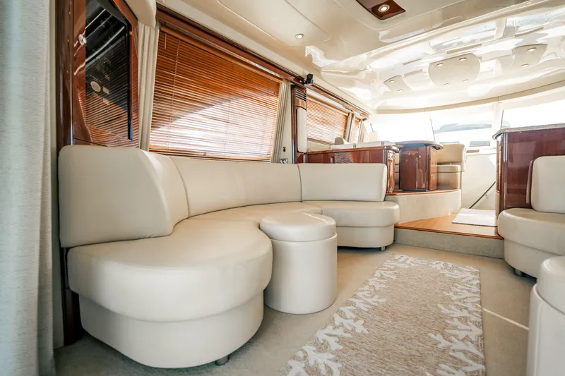Slide: The Image of Luxurious interior of 2007 Sea Ray 580 Sedan Bridge yacht with elegant seating and wood accents. - 28