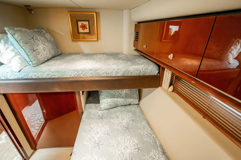 Slide: The Image of Luxurious 2007 Sea Ray 580 Sedan Bridge cabin with cozy bunk beds and elegant decor. - 38