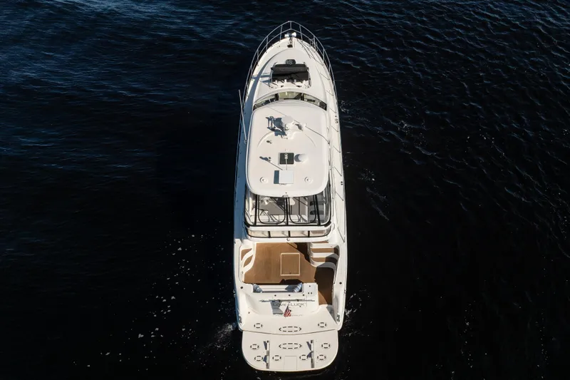 Slide: The Image of Aerial view of 2007 Sea Ray 580 Sedan Bridge yacht on dark water. - 8