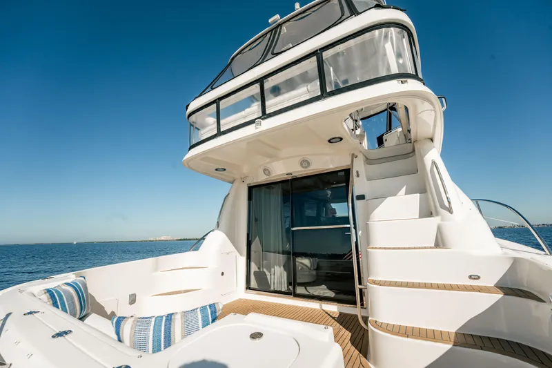 Slide: The Image of 2007 Sea Ray 580 Sedan Bridge yacht with spacious deck and elegant design on open water. - 9
