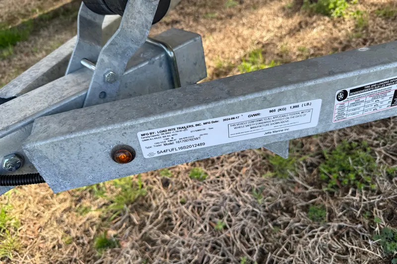 Slide: The Image of Trailer hitch with Load Rite Trailers label, Chincoteague 16 model, 1994. - 11