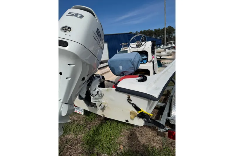 Slide: The Image of 1994 Chincoteague 16 boat with 50 HP Suzuki outboard motor on trailer. - 8