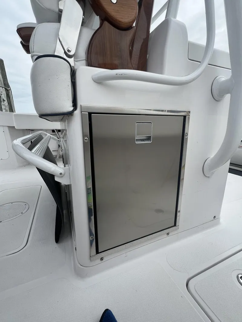 Slide: The Image of 2019 Southport 33 FE boat interior with stainless steel storage compartment. - 14