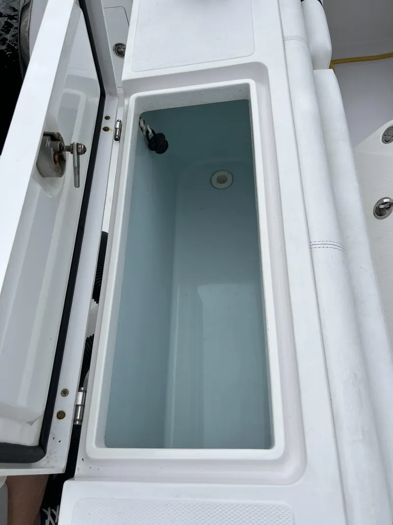 Slide: The Image of Open storage compartment on 2019 Southport 33 FE boat. - 17