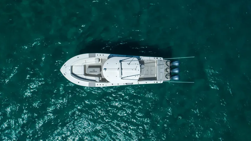 Slide: The Image of Aerial view of 2019 Regulator 34 boat on clear blue water. - 2