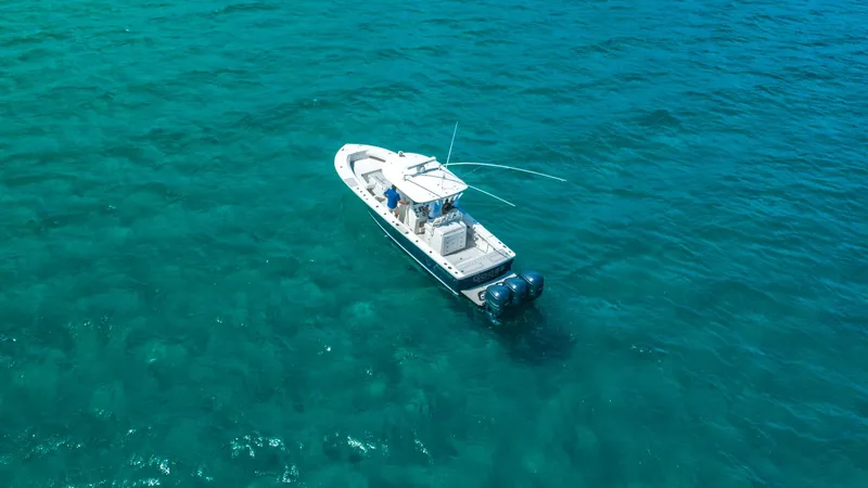 Slide: The Image of Aerial view of 2019 Regulator 34 boat on clear turquoise water. - 3