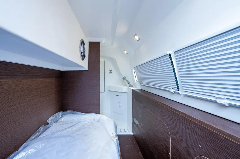Slide: The Image of Interior cabin of 2019 Prestige 460 yacht with bed and window blinds. - 26