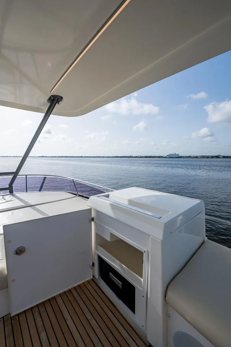 Slide: The Image of Prestige 460 yacht deck, 2019 model, with ocean view and clear skies. - 37