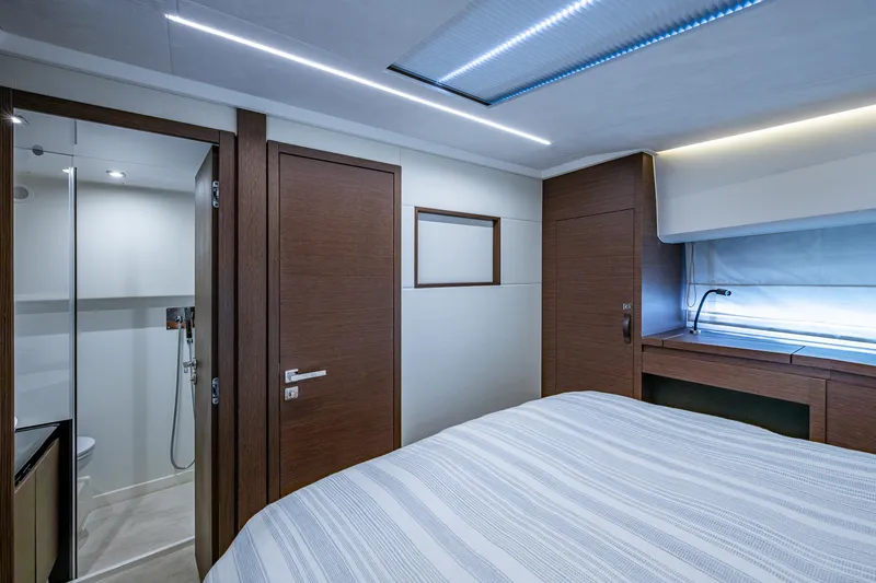 Slide: The Image of Luxurious interior of 2019 Prestige 460 yacht cabin with modern design and elegant wood finishes. - 41