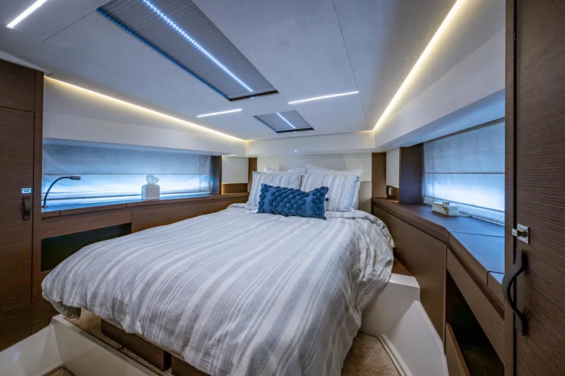Slide: The Image of Luxurious bedroom interior of 2019 Prestige 460 yacht with modern design and ambient lighting. - 44