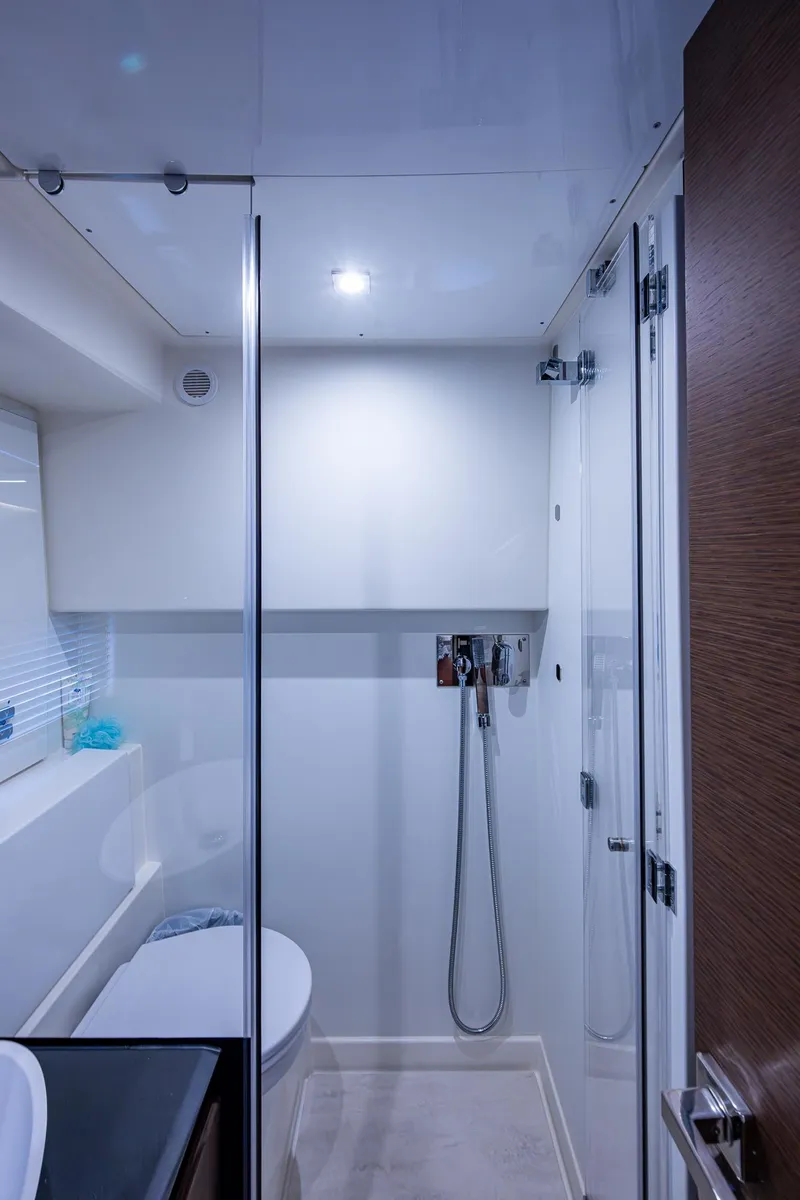Slide: The Image of Bathroom interior of a 2019 Prestige 460 yacht, featuring modern fixtures and sleek design. - 48