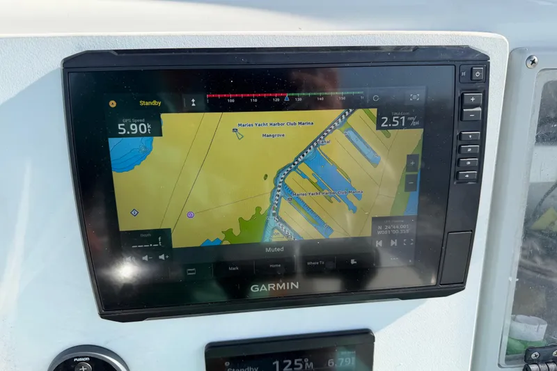 Slide: The Image of Garmin GPS display on 2001 Bluewater 2350 CC boat, showing marina navigation map. - 10