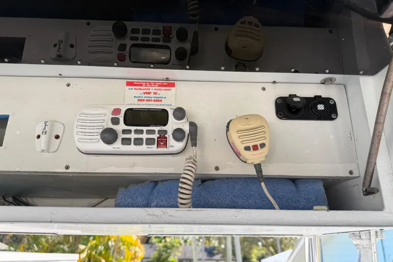Slide: The Image of 2001 Bluewater 2350 CC boat radio and communication equipment setup. - 15