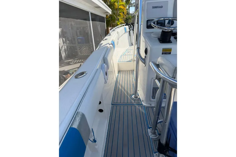 Slide: The Image of 2001 Bluewater 2350 CC boat interior with sleek design and modern controls. - 25