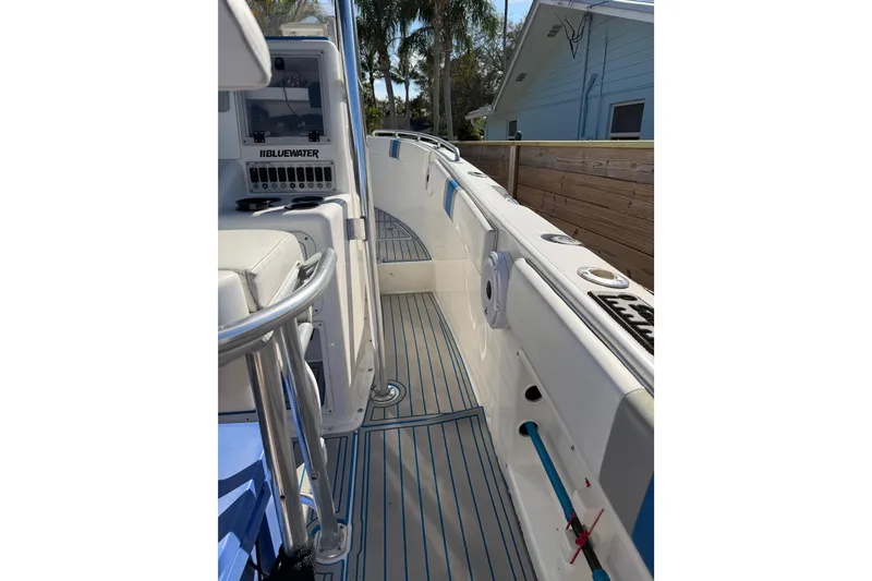 Slide: The Image of 2001 Bluewater 2350 CC boat interior with sleek design and modern features. - 26