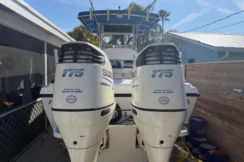 Slide: The Image of 2001 Bluewater 2350 CC boat with twin Suzuki 175 outboard engines. - 7