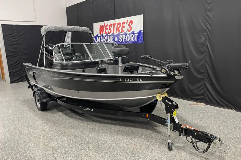 The Image of 2018 Lund 1875 Impact Sport boat on trailer at Westre's Marine & Sport showroom. - 1