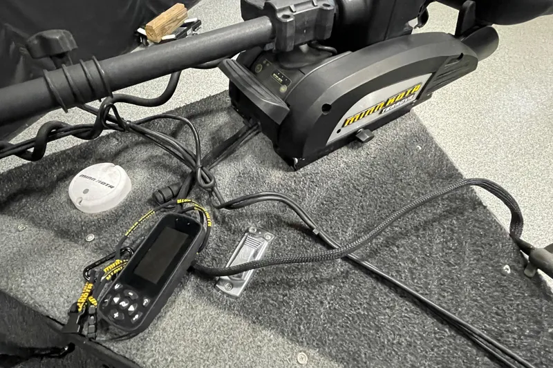 Slide: The Image of 2018 Lund 1875 Impact Sport boat with Minn Kota trolling motor and control panel. - 16