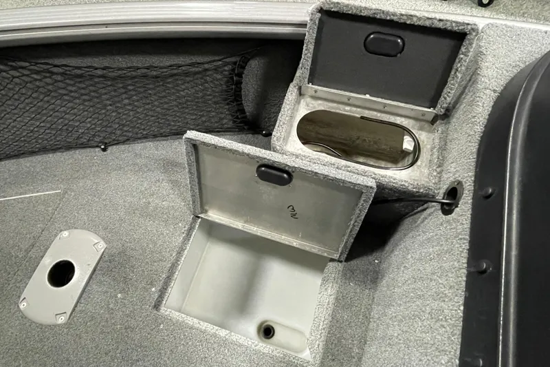 Slide: The Image of 2018 Lund 1875 Impact Sport boat storage compartments with open lids. - 19