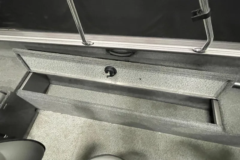 Slide: The Image of 2018 Lund 1875 Impact Sport boat storage compartment, open and empty. - 23