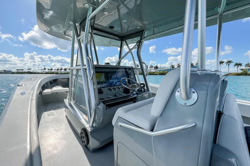 Slide: The Image of 2018 SeaVee 390Z boat interior with modern helm, sleek design, and ocean view. - 10