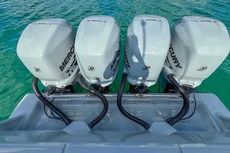 Slide: The Image of 2018 SeaVee 390Z boat with four Mercury outboard engines on turquoise water. - 6